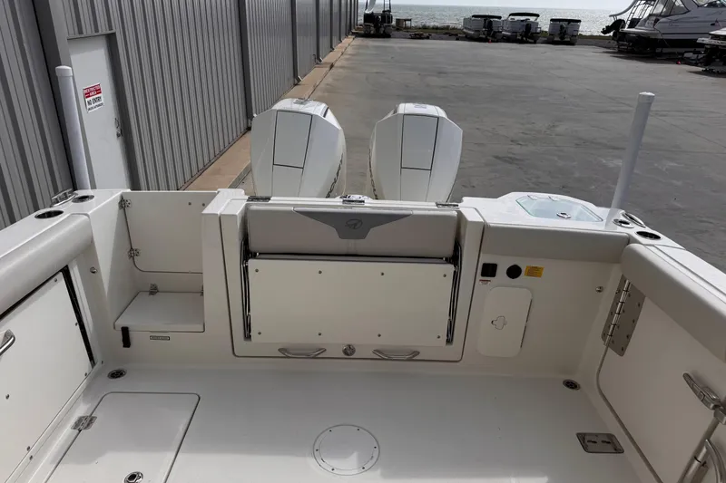 Slide: The Image of Sailfish 276 DC 2026 model boat interior with dual outboard motors. - 8