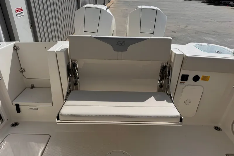 Slide: The Image of 2026 Sailfish 276 DC boat interior with foldable seating and storage compartments. - 9