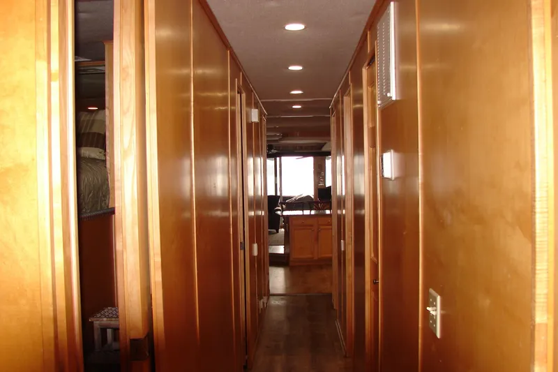 Slide: The Image of Hallway inside 1999 Sumerset 18x90 houseboat with wooden paneling and recessed lighting. - 26