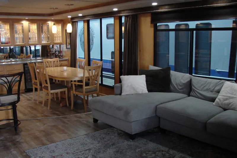 Slide: The Image of Luxurious 1999 Sumerset 18x90 houseboat interior with modern kitchen and cozy living area. - 9