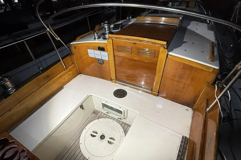 Slide: The Image of Cockpit of 1959 Sparkman & Stephens Custom 46 sailboat with wooden and white finishes. - 11