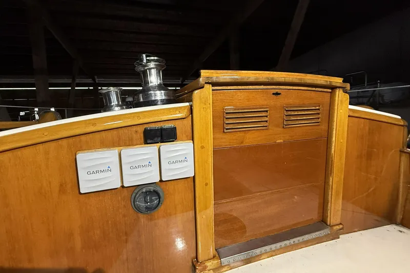 Slide: The Image of 1959 Sparkman & Stephens Custom 46 yacht cockpit with Garmin equipment and wooden finish. - 12