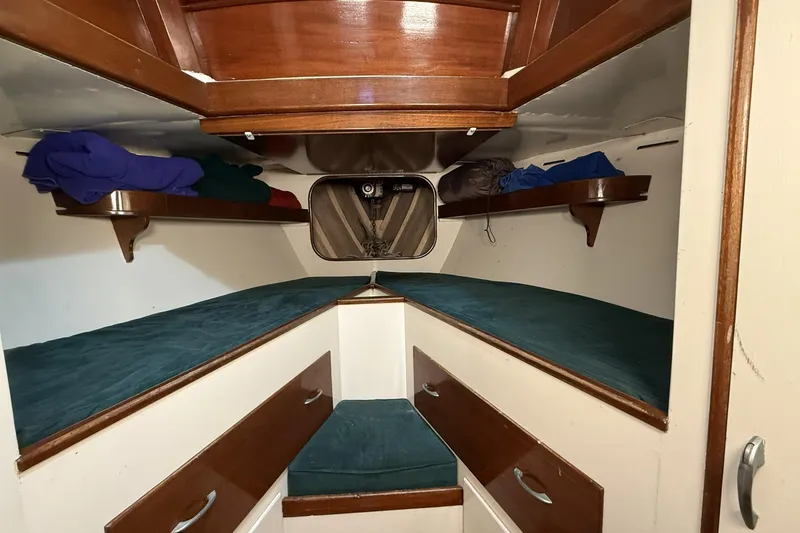 Slide: The Image of Cozy cabin interior of 1959 Sparkman & Stephens Custom 46 sailboat with wooden accents. - 17