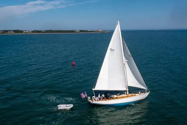 Slide: The Image of Sailing yacht Sparkman & Stephens Custom 46, 1959, cruising on open water with American flag. - 3