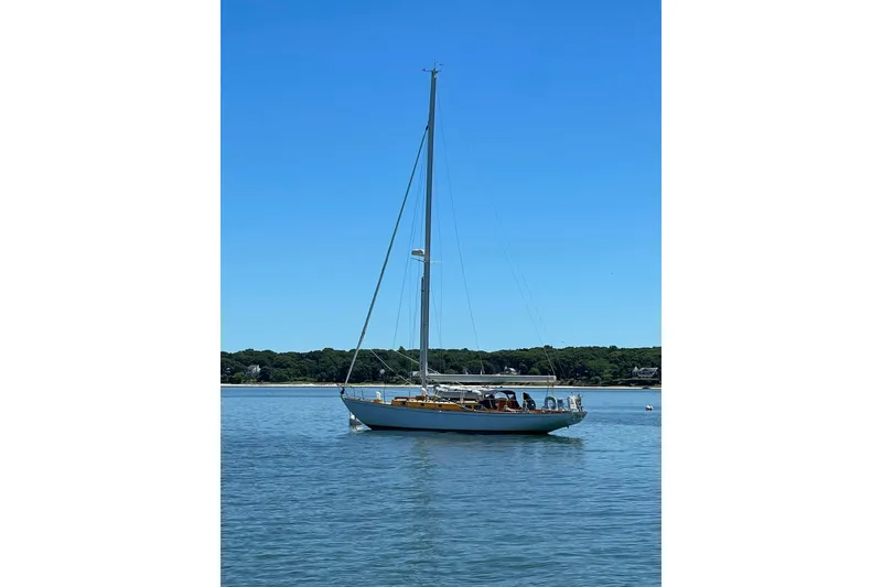 Slide: The Image of Sailboat on calm water, Sparkman & Stephens Custom 46, 1959, under clear blue sky. - 4