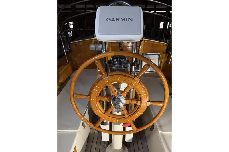 Slide: The Image of Wooden steering wheel of 1959 Sparkman & Stephens Custom 46 yacht with Garmin navigation. - 9