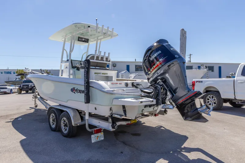 Slide: The Image of 2022 Crevalle 24 HCO boat with Yamaha outboard engine on trailer in parking lot. - 14