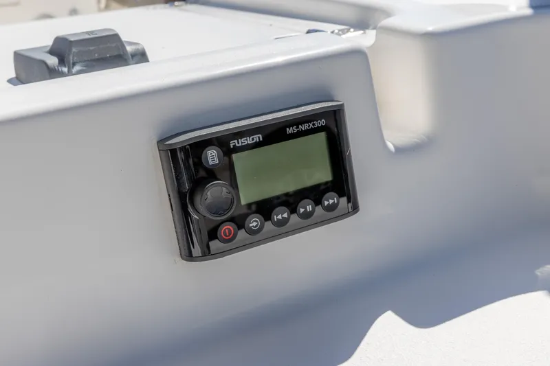 Slide: The Image of Fusion MS-NRX300 stereo control on 2022 Crevalle 24 HCO boat dashboard. - 16