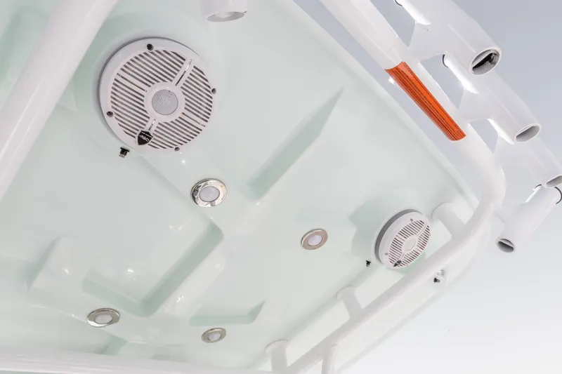 Slide: The Image of 2022 Crevalle 24 HCO boat speakers and rod holders on white T-top. - 19
