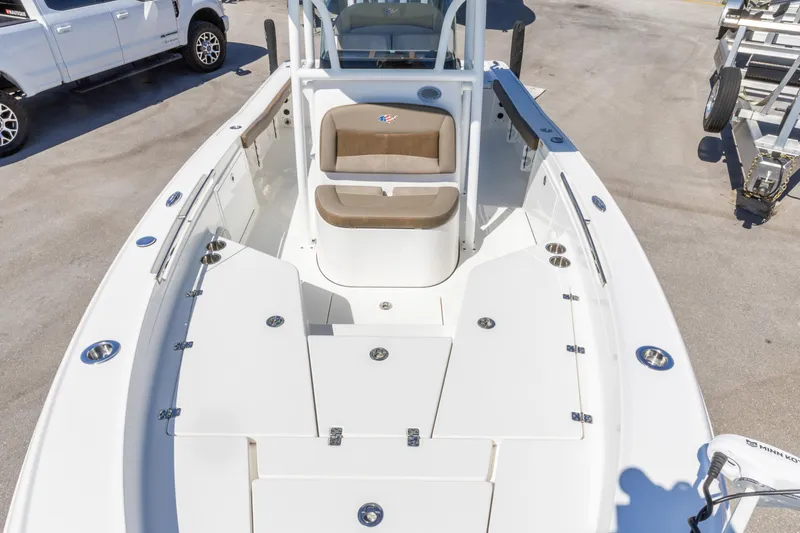 Slide: The Image of 2022 Crevalle 24 HCO boat interior with seating and storage compartments. - 2