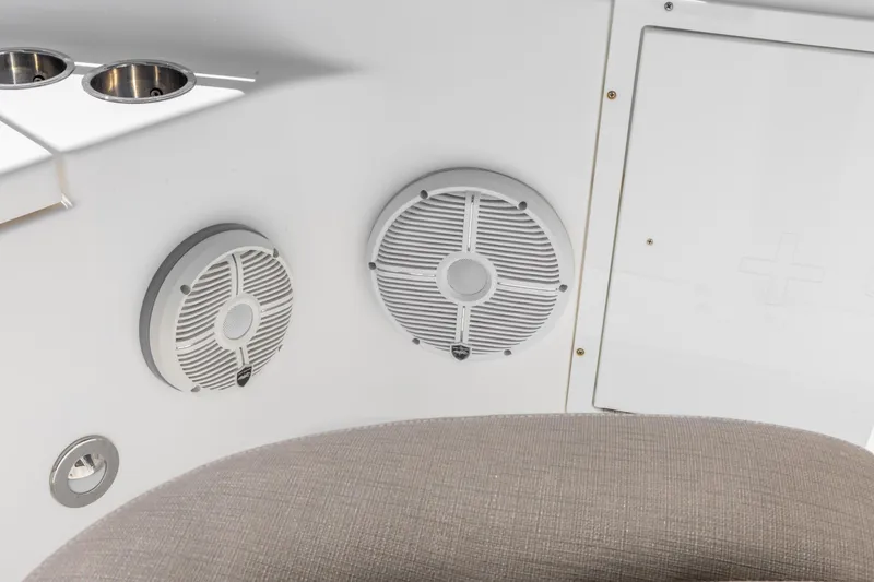 Slide: The Image of 2022 Crevalle 24 HCO boat interior with speakers and cup holders. - 20