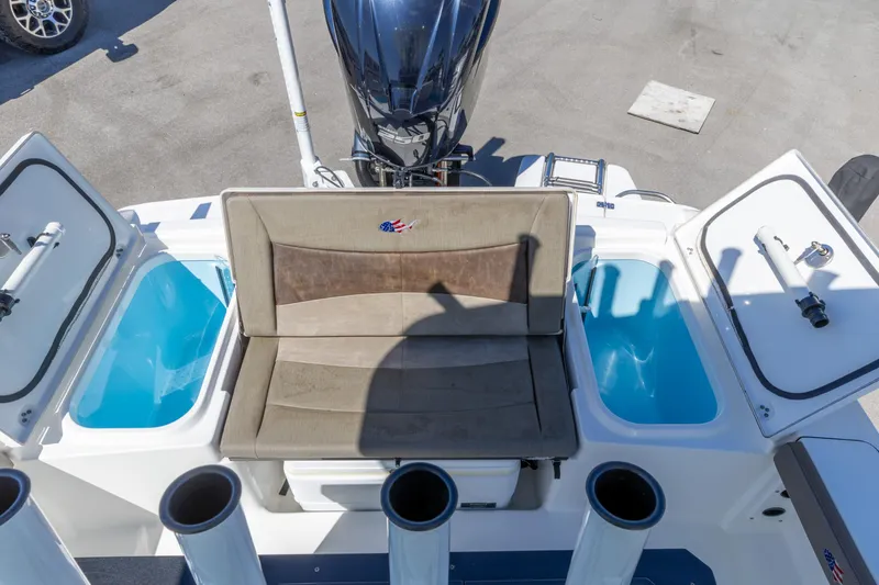 Slide: The Image of 2022 Crevalle 24 HCO boat interior with seating and storage compartments. - 6