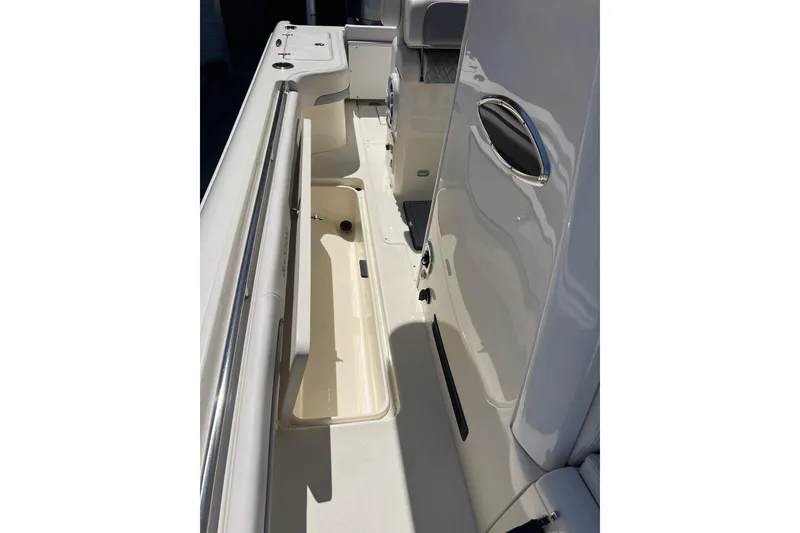 Slide: The Image of Interior view of 2026 Blackwood 270 boat, featuring sleek design and storage compartments. - 11