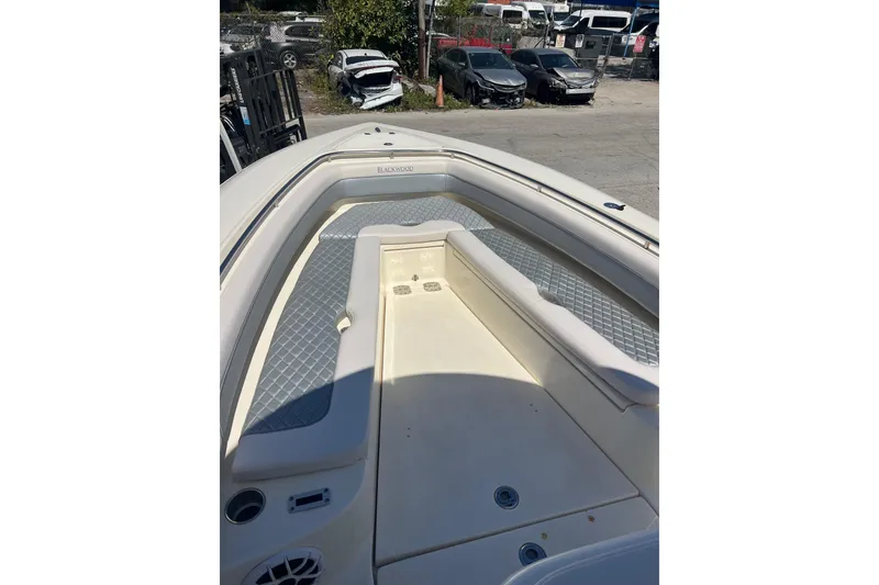Slide: The Image of 2026 Blackwood 270 boat interior with cushioned seating and storage compartments. - 14