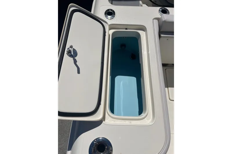 Slide: The Image of Open storage compartment on 2026 Blackwood 270 boat deck. - 16