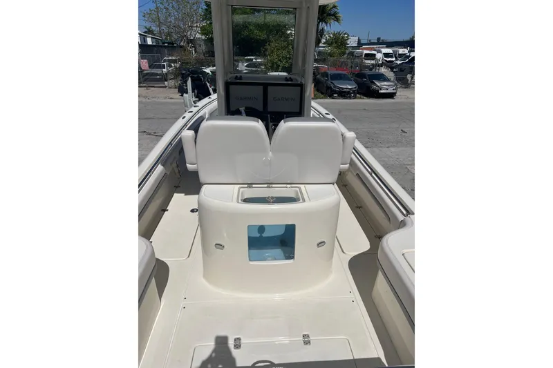 Slide: The Image of 2026 Blackwood 270 boat interior with Garmin displays, white seating, and storage compartments. - 4