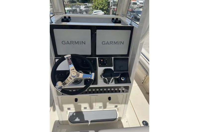 Slide: The Image of 2026 Blackwood 270 boat dashboard with dual Garmin displays and modern steering wheel. - 5