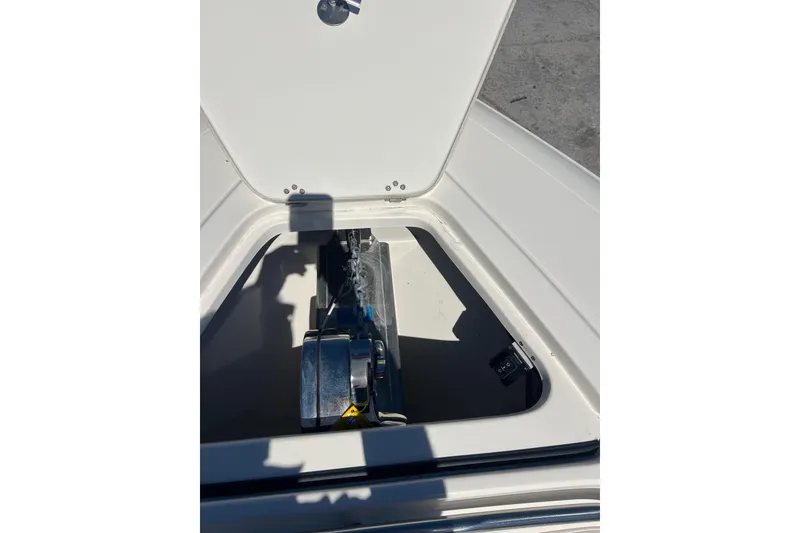 Slide: The Image of Open hatch of 2026 Blackwood 270 boat showing anchor storage compartment. - 7
