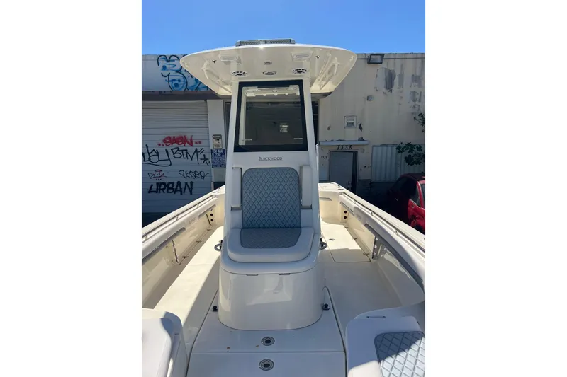 Slide: The Image of 2026 Blackwood 270 boat interior with cushioned seating and modern design. - 8