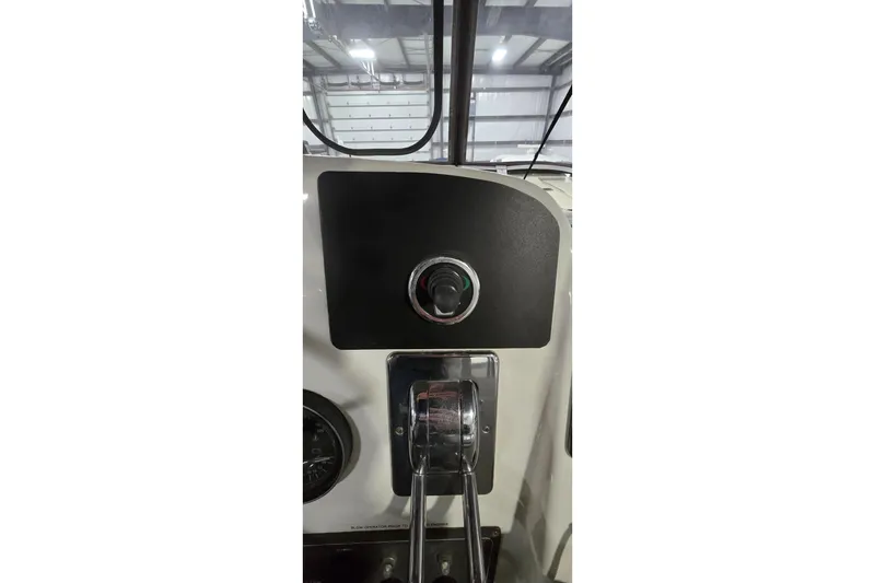 Slide: The Image of 1998 Silverton 322 Motor Yacht helm controls and dashboard in a marina setting. - 10