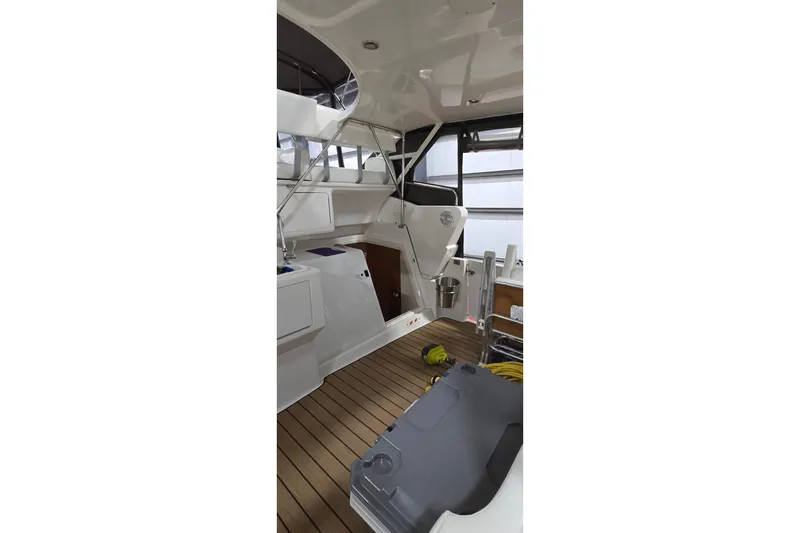 Slide: The Image of 1998 Silverton 322 Motor Yacht interior with wooden flooring and modern design elements. - 20