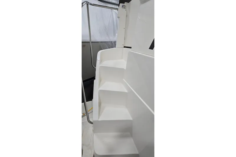 Slide: The Image of Staircase on 1998 Silverton 322 Motor Yacht with sleek white design and metal railing. - 21
