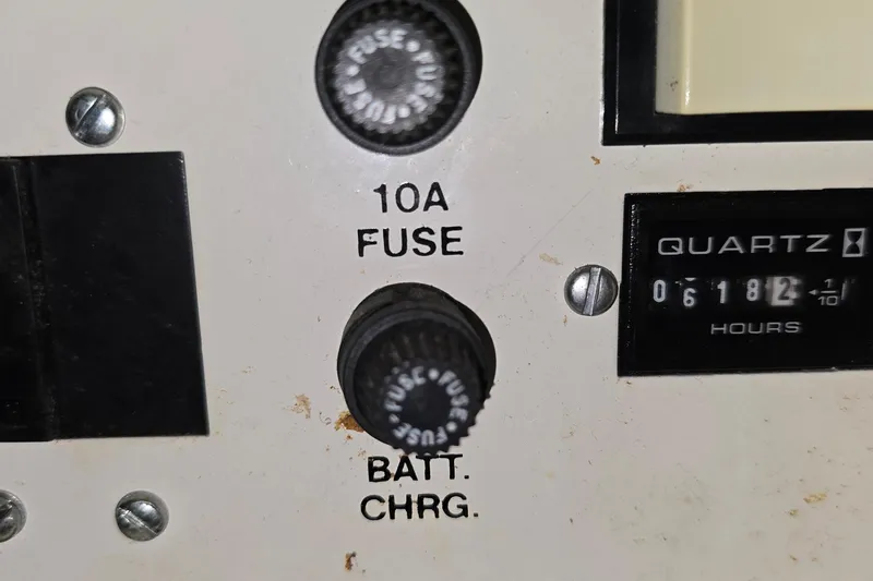 Slide: The Image of Control panel of a 1998 Silverton 322 Motor Yacht with 10A fuse and hour meter. - 55