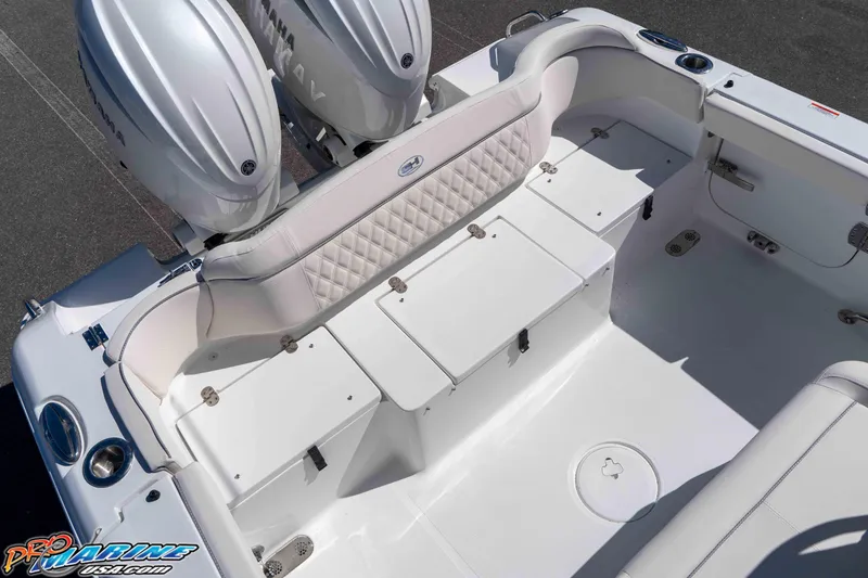 Slide: The Image of 2026 Sea Hunt Ultra 265 SE boat interior with Yamaha engines, featuring spacious seating and storage. - 14