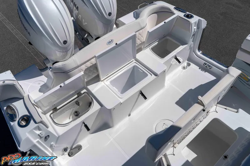Slide: The Image of 2026 Sea Hunt Ultra 265 SE boat interior with storage compartments and Yamaha engines. - 15