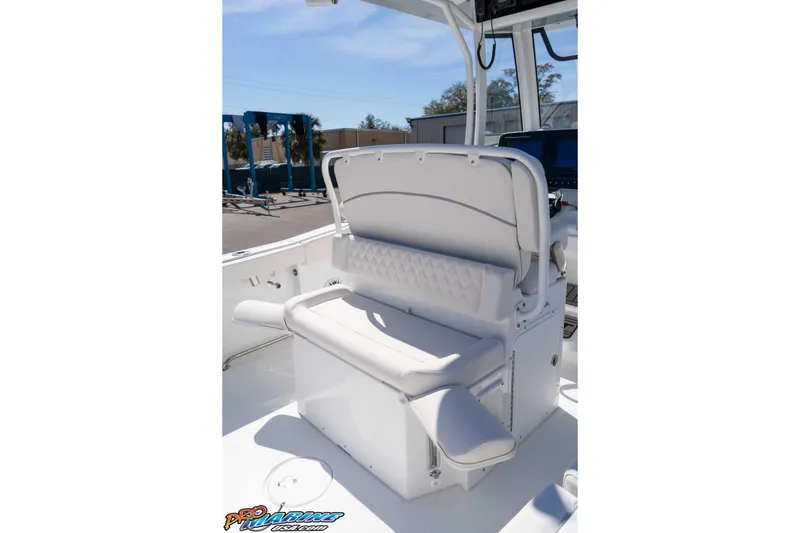 Slide: The Image of 2026 Sea Hunt Ultra 265 SE boat interior with cushioned seating and modern design. - 16