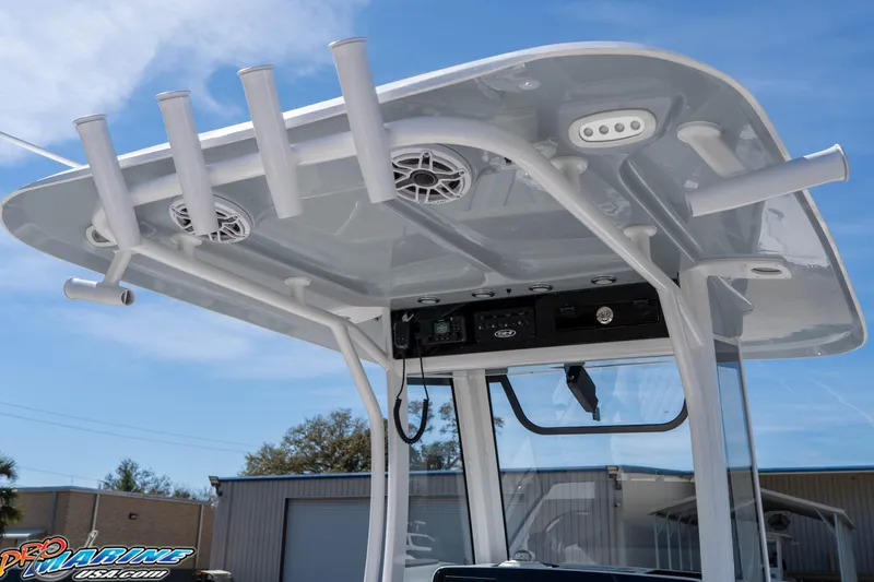 Slide: The Image of 2026 Sea Hunt Ultra 265 SE boat T-top with rod holders and speakers. - 17