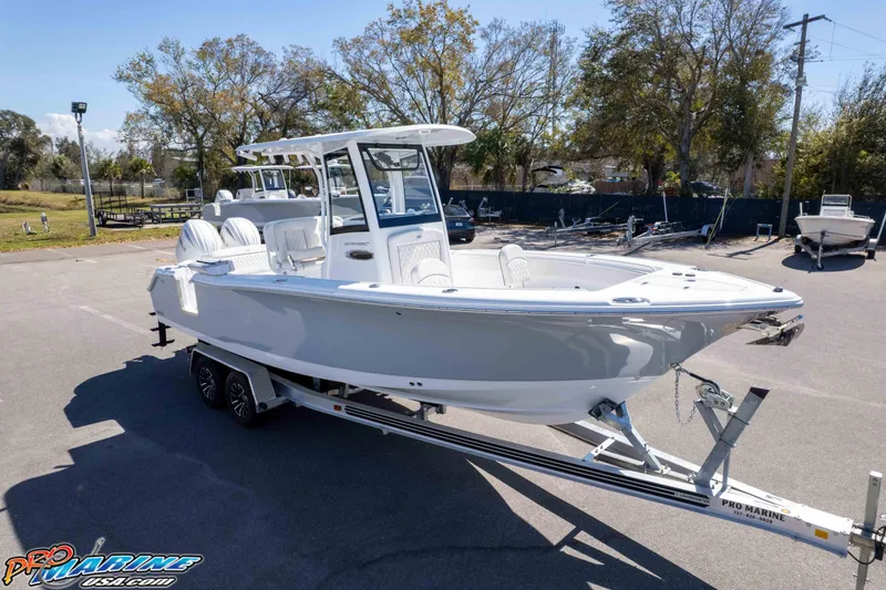 Slide: The Image of 2026 Sea Hunt Ultra 265 SE boat on trailer in sunny outdoor setting. - 28