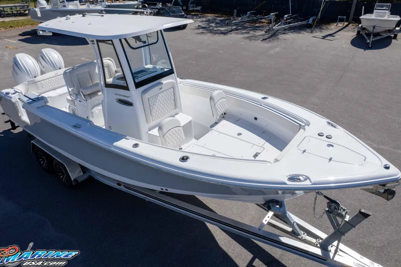 Slide: The Image of 2026 Sea Hunt Ultra 265 SE boat on trailer, showcasing sleek design and spacious deck. - 29