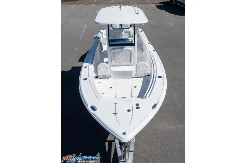 Slide: The Image of 2026 Sea Hunt Ultra 265 SE boat, aerial view, showcasing sleek design and spacious deck. - 32