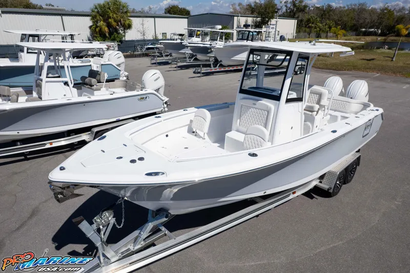 Slide: The Image of 2026 Sea Hunt Ultra 265 SE boat on trailer, displayed outdoors at dealership. - 34