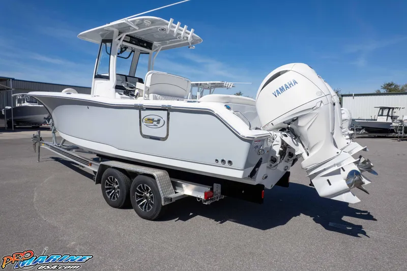 Slide: The Image of 2026 Sea Hunt Ultra 265 SE boat with Yamaha outboard engine on a trailer. - 37