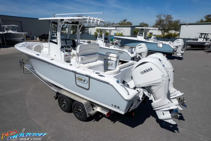 Slide: The Image of 2026 Sea Hunt Ultra 265 SE boat with Yamaha engines on a trailer. - 38