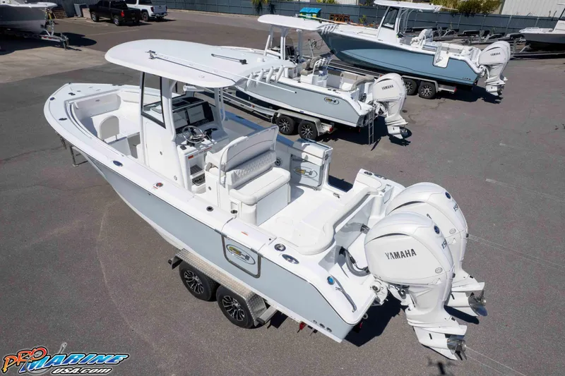 Slide: The Image of 2026 Sea Hunt Ultra 265 SE boat with dual Yamaha engines on a trailer. - 39