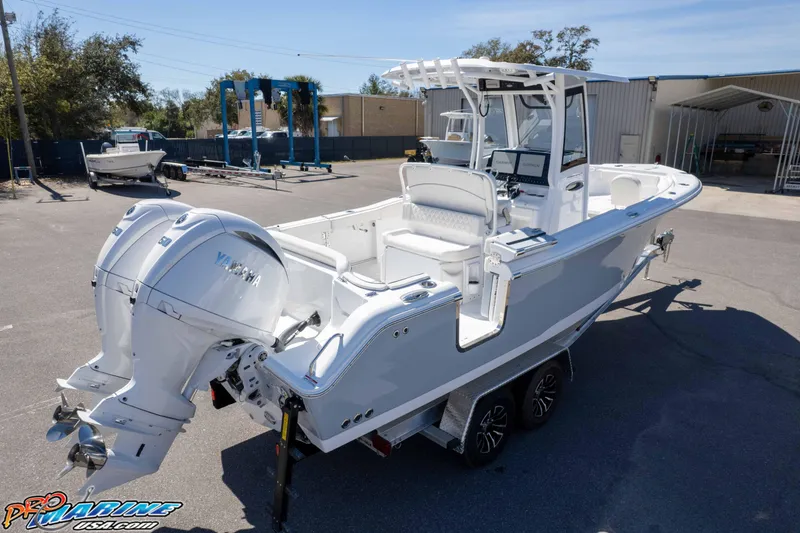 Slide: The Image of 2026 Sea Hunt Ultra 265 SE boat with dual Yamaha engines on a trailer. - 43