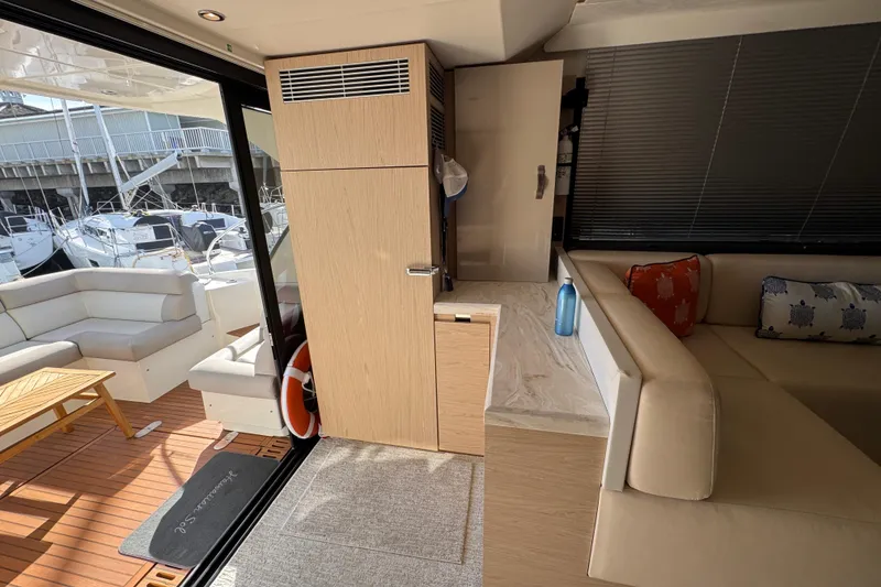 Slide: The Image of Interior of 2020 Beneteau Monte Carlo 52 yacht with modern seating and decor. - 12