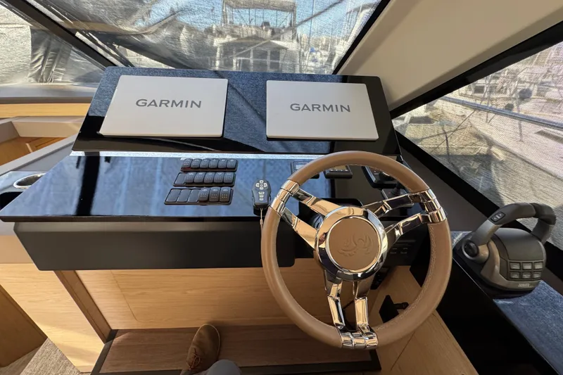 Slide: The Image of Helm of 2020 Beneteau Monte Carlo 52 with Garmin navigation displays and steering wheel. - 19