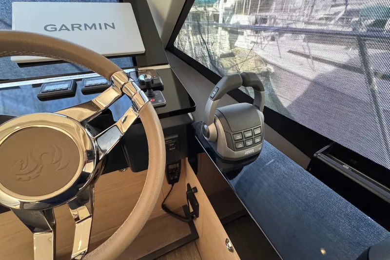 Slide: The Image of Steering wheel and controls of 2020 Beneteau Monte Carlo 52 yacht with Garmin navigation. - 20