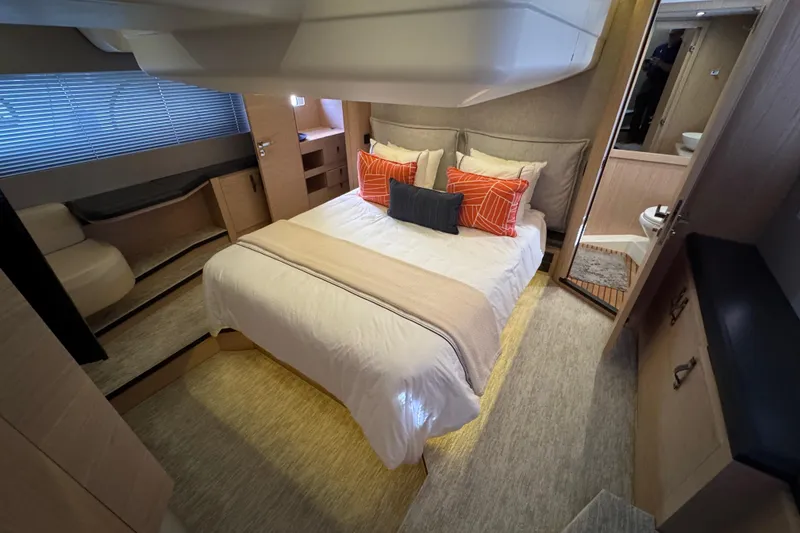 Slide: The Image of Luxurious bedroom interior of 2020 Beneteau Monte Carlo 52 yacht with modern decor. - 25