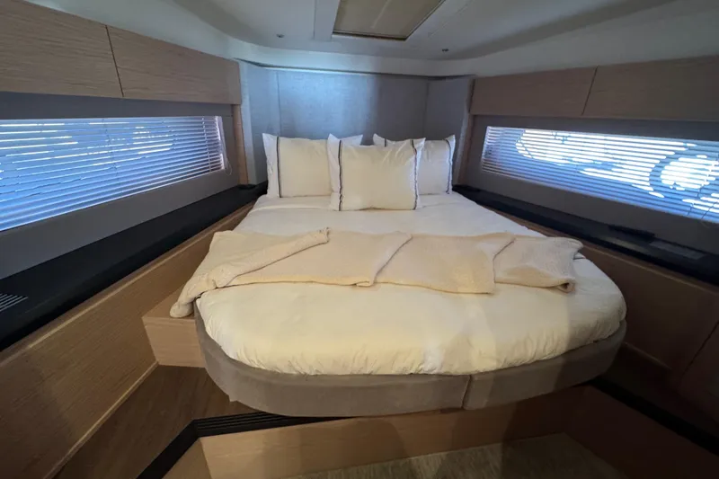 Slide: The Image of Luxurious bedroom interior of 2020 Beneteau Monte Carlo 52 yacht with cozy bedding. - 33