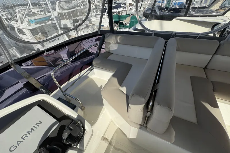 Slide: The Image of Interior view of 2020 Beneteau Monte Carlo 52 yacht with seating and Garmin equipment. - 46