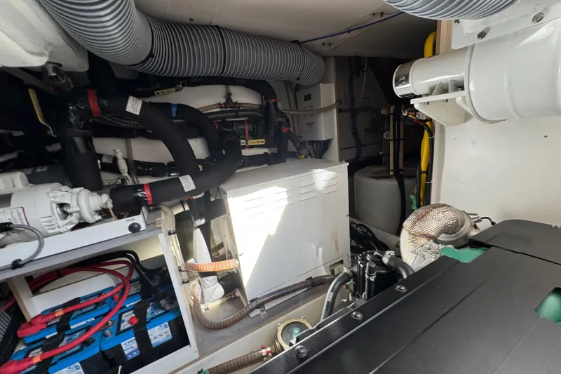 Slide: The Image of Engine room of 2020 Beneteau Monte Carlo 52 yacht, showcasing mechanical components and systems. - 59