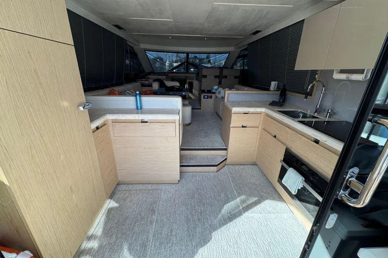 Slide: The Image of Luxurious interior of 2020 Beneteau Monte Carlo 52 yacht with modern kitchen design. - 9