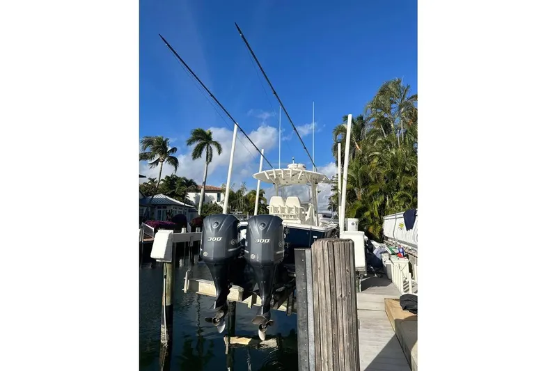 Slide: The Image of 2015 Regulator 28 Forward Seating boat docked with dual 300 horsepower engines. - 17