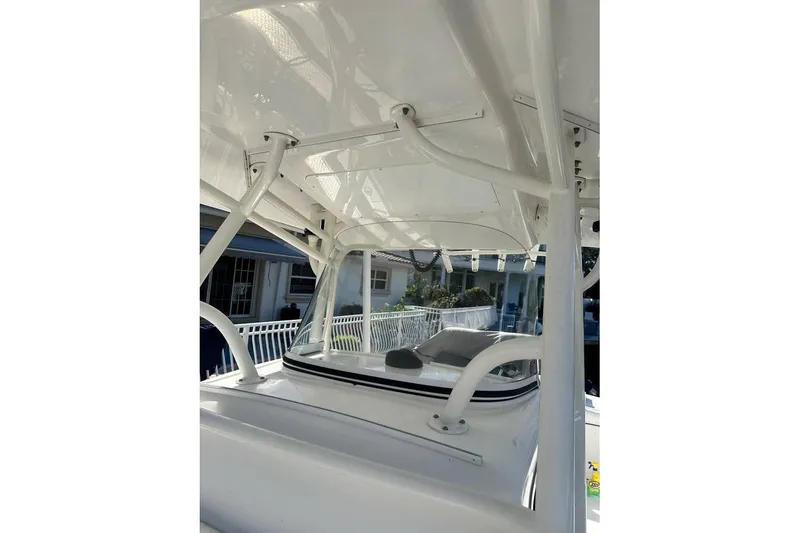 Slide: The Image of 2015 Regulator 28 Forward Seating boat interior with white framework and seating. - 18