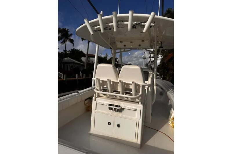 Slide: The Image of 2015 Regulator 28 Forward Seating boat interior with helm and seating area. - 20